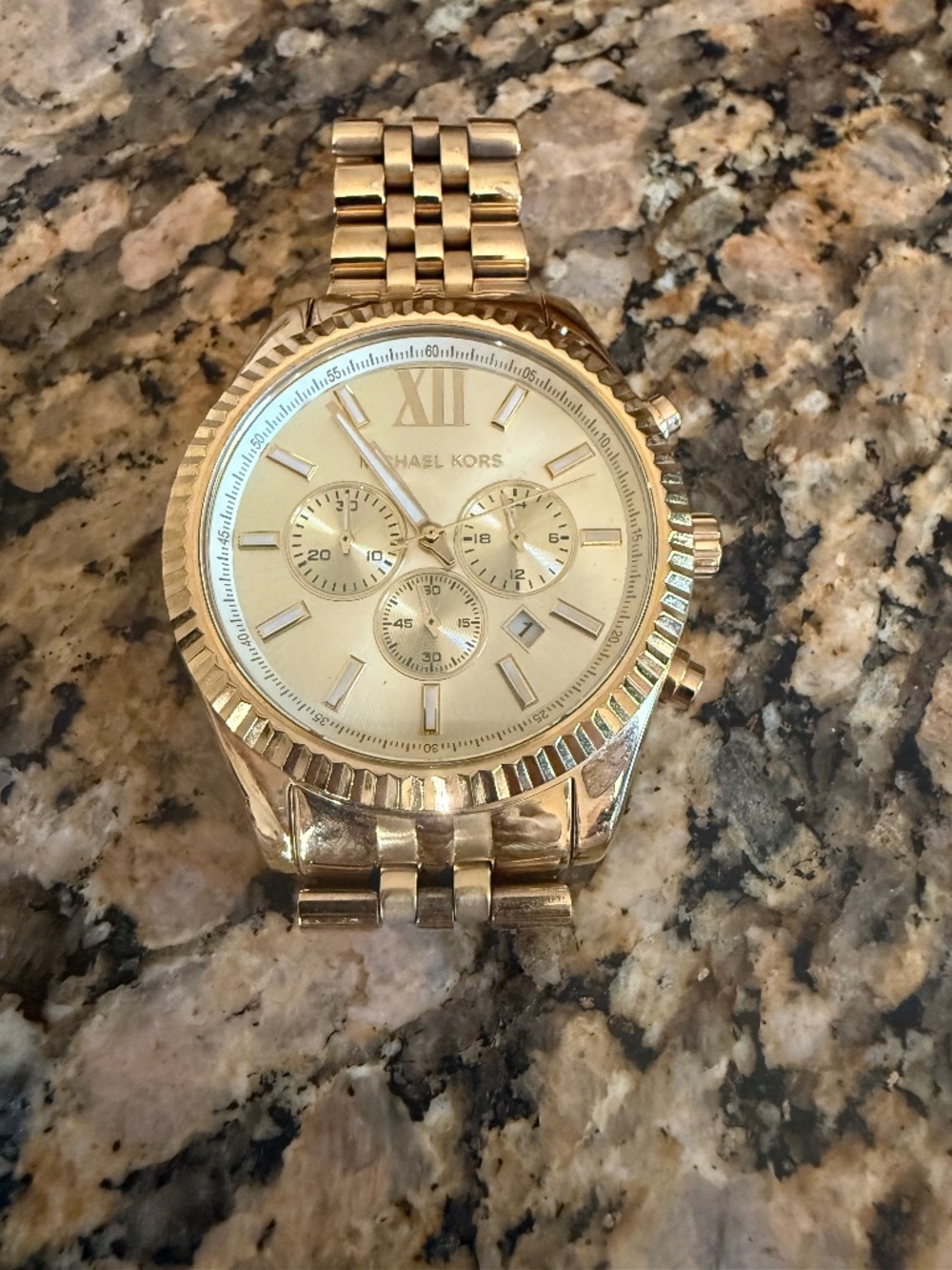 Michael Kors Oversized gold watch.